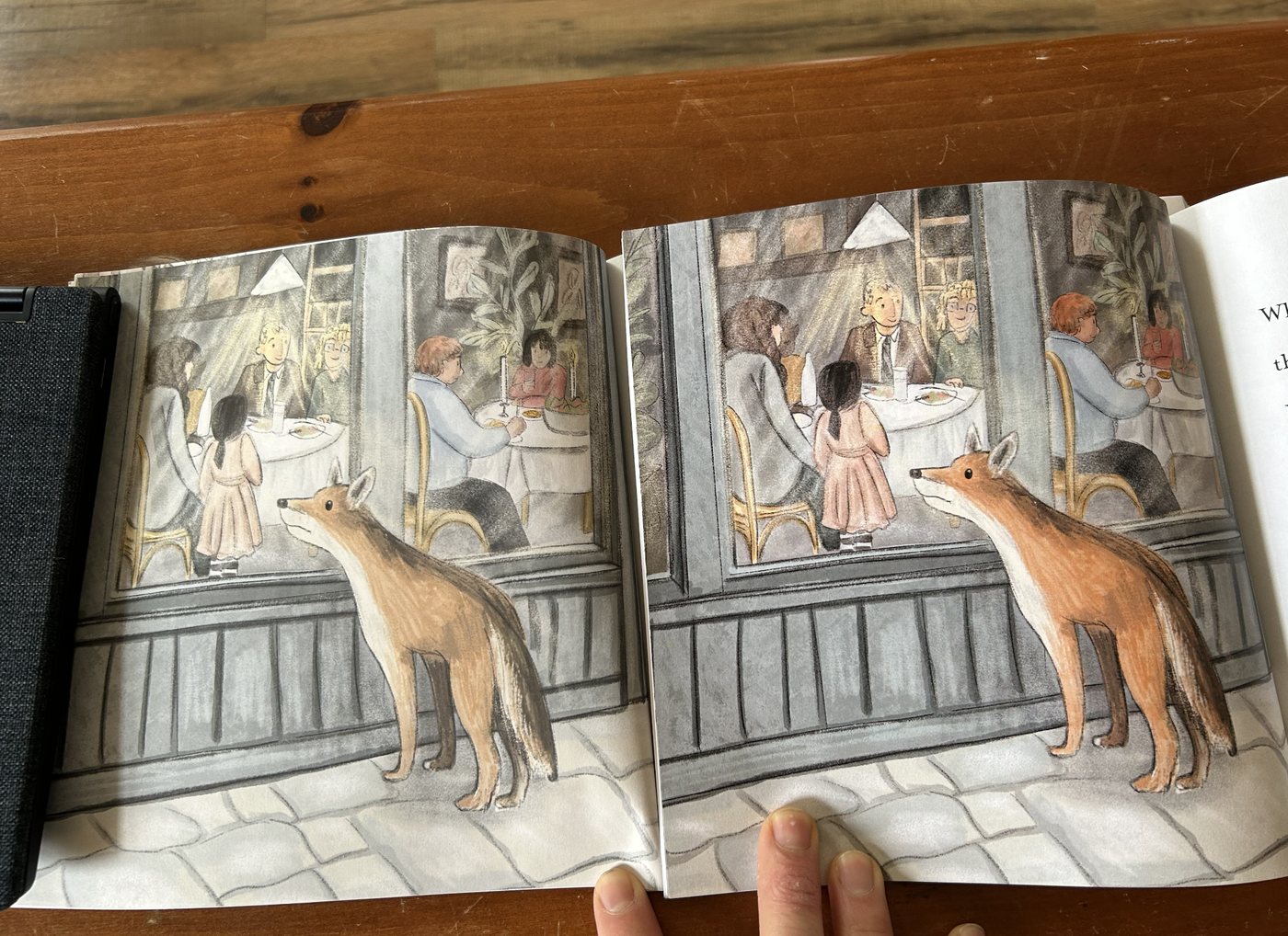 An open spread from Little Coyote: a coyote looking through a café window